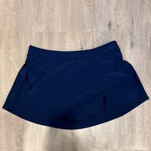Women's blue swim skort. High waisted tummy control